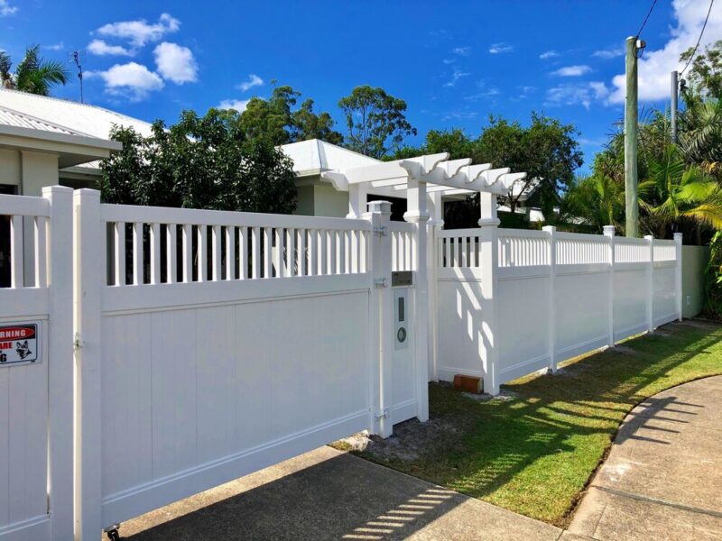 Mary white PVC boundary fence with entry gate and pergola at a Queensland home