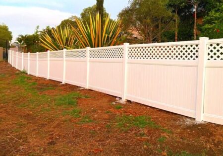 Bertha lattice-top privacy fence gallery with long fence run and feature planting by Queensland Fencing Specialists