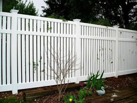 Caroline PVC fence gallery fence line with garden border by Queensland Fencing Specialists
