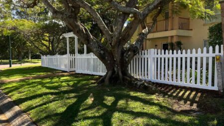 Elizabeth scalloped picket fence gallery with arbor entry and mature tree setting by Queensland Fencing Specialists