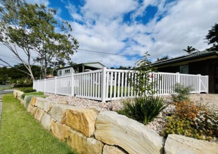 Margaret PVC garden fence gallery on a raised front boundary by Queensland Fencing Specialists