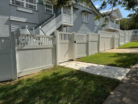 Mary PVC fence gallery with pedestrian gate and driveway access by Queensland Fencing Specialists