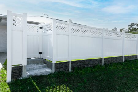 Bertha lattice-top privacy fence gallery with side access gate and raised entry by Queensland Fencing Specialists